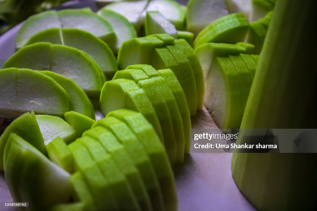 Green Sliced vegetable,Calabash (Lagenaria siceraria), also known as bottle gourd, white-flowered gourd, long melon, New Guinea bean and Tasmania bean, is a vine grown vegetable.