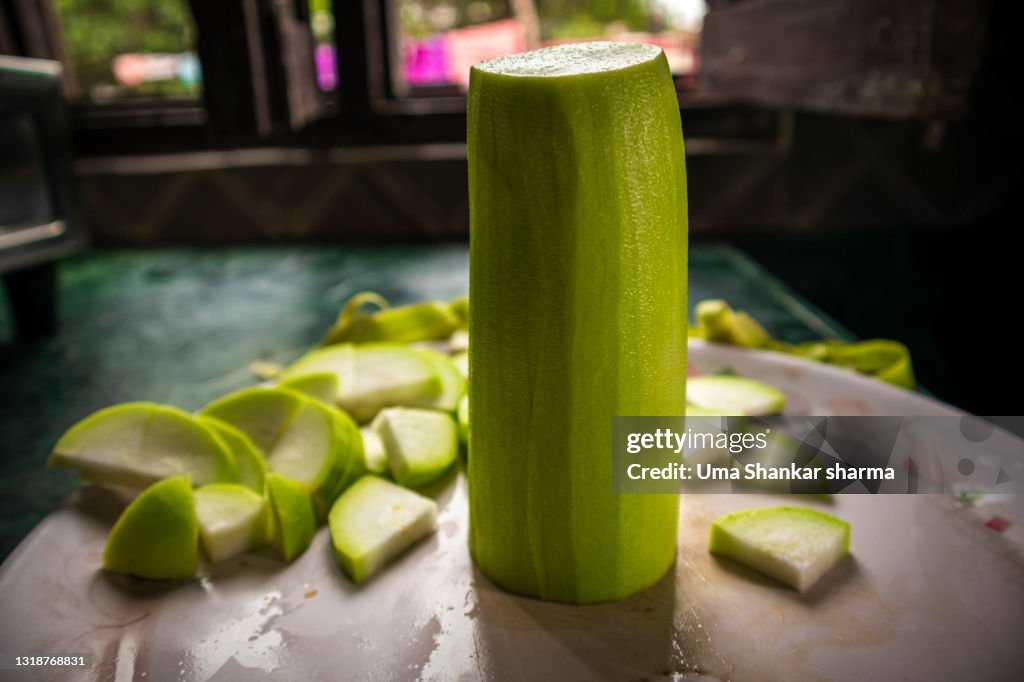 Green Sliced vegetable,Calabash (Lagenaria siceraria), also known as bottle gourd, white-flowered gourd, long melon, New Guinea bean and Tasmania bean, is a vine grown vegetable.