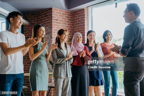 business leader giving a speech to his team - applauding staff stock pictures, royalty-free photos & images