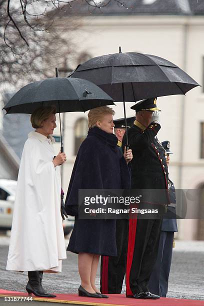 Queen Sonja of Norway, Lithuania's President Dalia Grybauskaite and King Harald V of Norway attend a wreath laying ceremony at the National Monument...