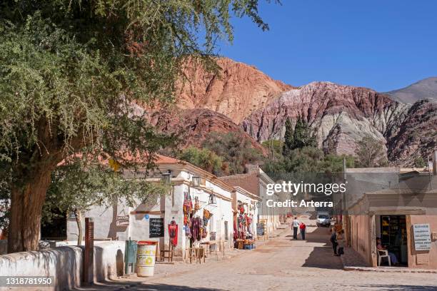 Street with souvenir shops in the village Purmamarca at the foot of Cerro de los Siete Colores, Quebrada de Purmamarca, Jujuy Province, Argentina.