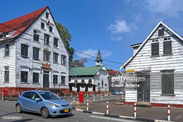 White wooden houses and little church in Dutch colonial style in the historic inner city of Paramaribo, Paramaribo District, Suriname / Surinam.