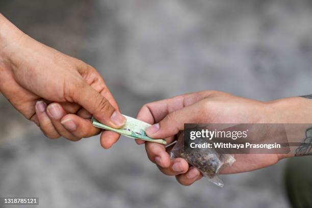 drug addict buying narcotics and paying - drug delivery ストックフォトと画像