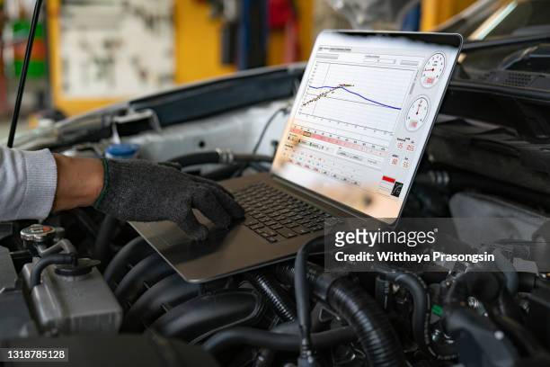 professional car mechanic working in auto repair service. - garage home car repair stock pictures, royalty-free photos & images