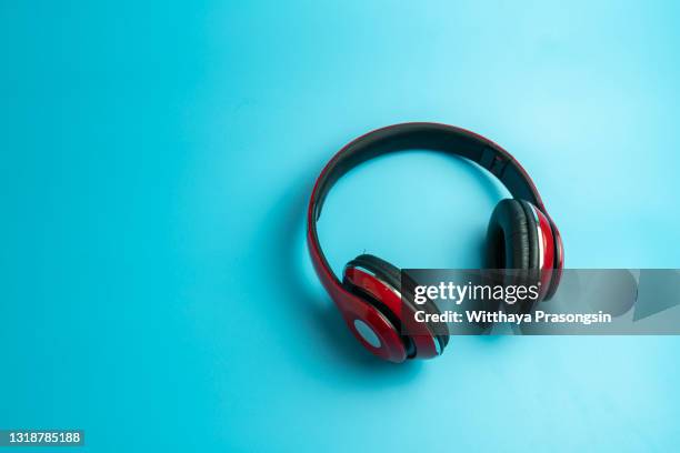 red headphone isolated on blue background - headphones isolated ストックフォトと画像