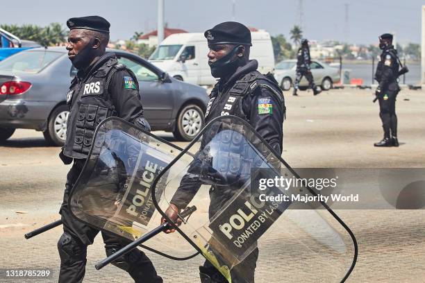 Policemen in riot gear and AK-47s during a demonstration against the re-opening of the Lekki toll plaza in Lagos. Activists had called for a renewed...