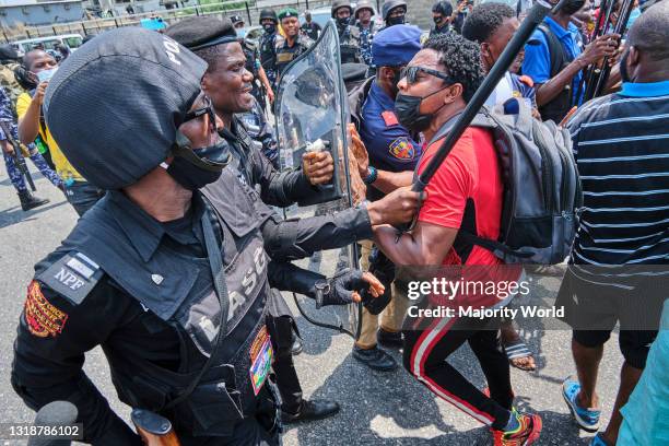 Policeman arresting a protestor during a demonstration against the re-opening of the Lekki toll plaza in Lagos. Activists had called for a renewed...