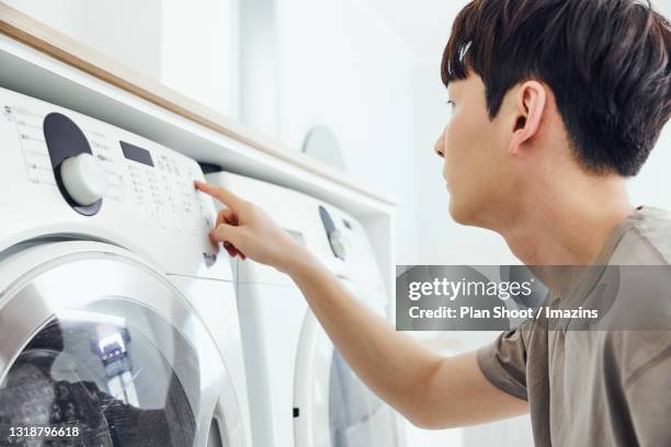 Pushing Washing 61 Washing Machine Shoot Stock Photos, High-Res Pictures, and Images ...