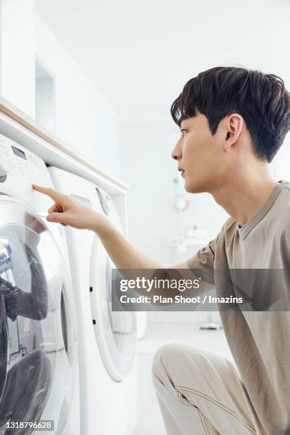 Pushing Washing 69 Washing Machine Shoot Stock Photos, High-Res Pictures, and Images ...