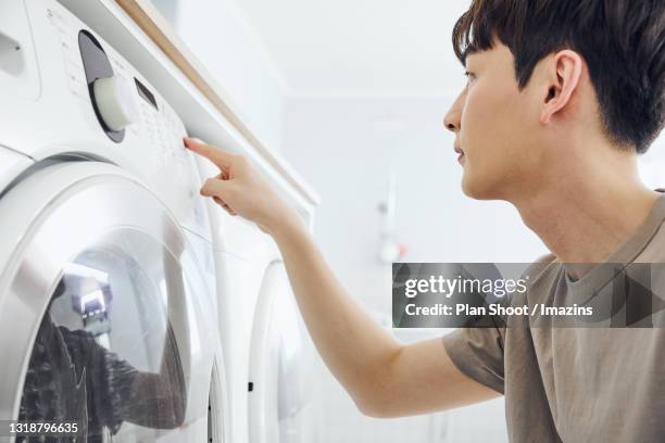 Pushing Washing 69 Washing Machine Shoot Stock Photos, High-Res Pictures, and Images ...