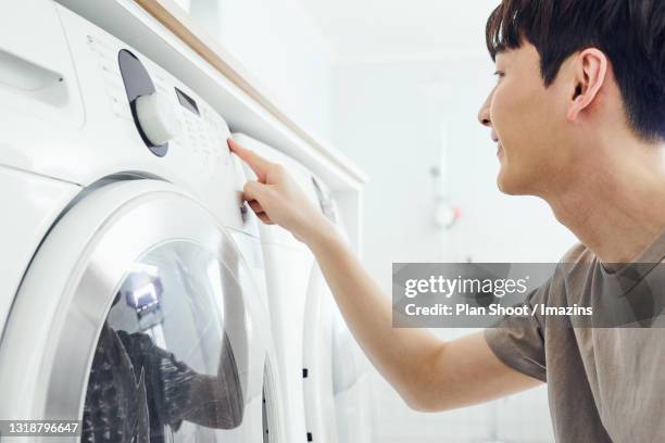 Pushing Washing 69 Washing Machine Shoot Stock Photos, High-Res Pictures, and Images ...