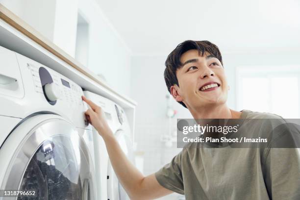 Pushing Washing 61 Washing Machine Shoot Stock Photos, High-Res Pictures, and Images ...