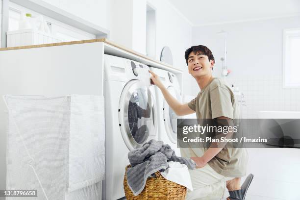 Pushing Washing 61 Washing Machine Shoot Stock Photos, High-Res Pictures, and Images ...