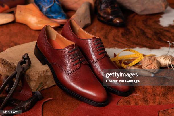 fine leather shoes on the shoemaking table - leather shoe stock-fotos und bilder