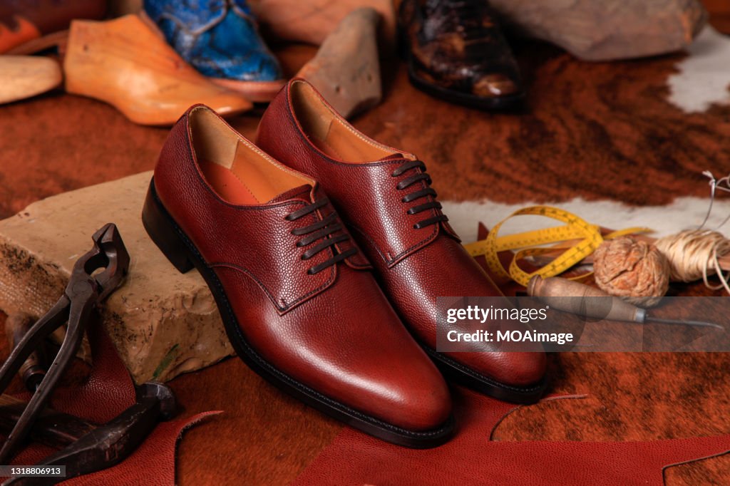 Fine leather shoes on the shoemaking table