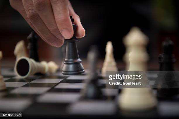 playing chess. - king chess piece stock-fotos und bilder