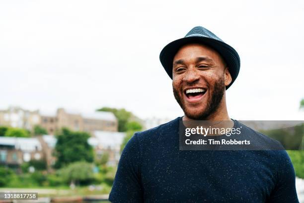 portrait of man laughing - pork pie stock pictures, royalty-free photos & images