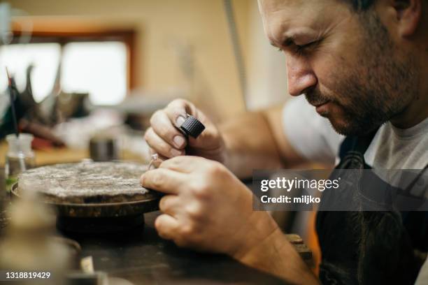 jewelry manufacture - examining diamond stock pictures, royalty-free photos & images