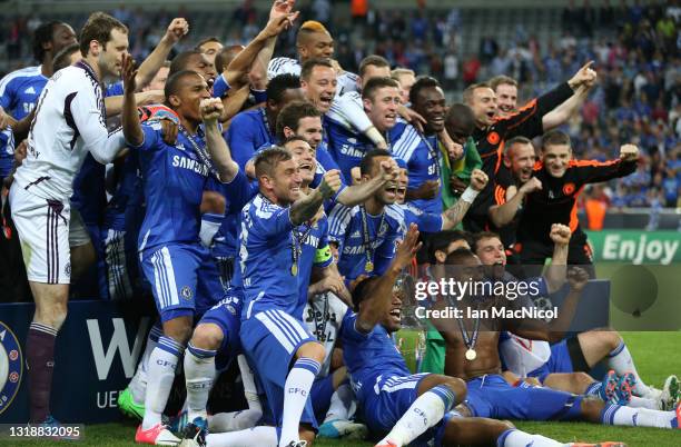 Didier Drogba and Chelsea team mates celebrate with the trophy during UEFA Champions League Final between FC Bayern Muenchen and Chelsea at the...