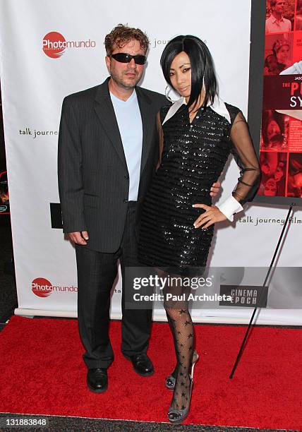 Producer / Director Allen Cognata and Actress Bai Ling arrive at "The Putt Putt Syndrome" premiere at The Culver Plaza Theaters on June 3, 2011 in...