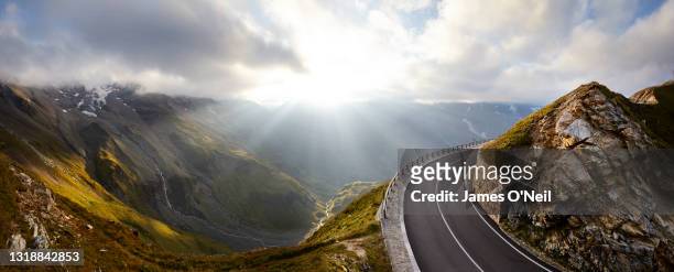 empty alpine road at sunset - grossglockner fotografías e imágenes de stock
