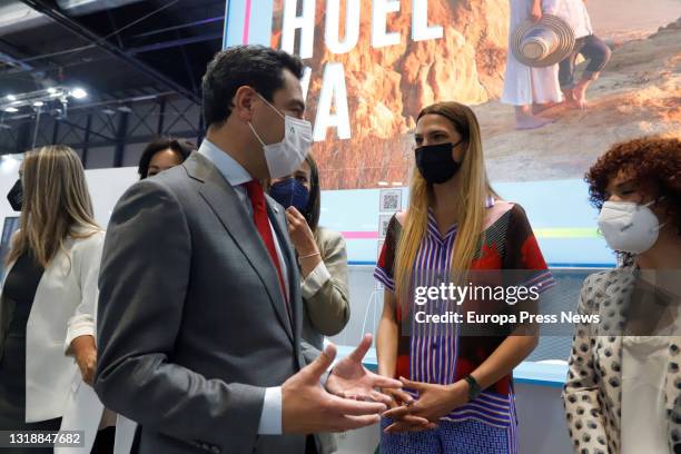 The president of the Junta de Andalucia, Juanma Moreno, greets the model Laura Sanchez, during the inauguration of the Andalusian pavilion at Fitur...