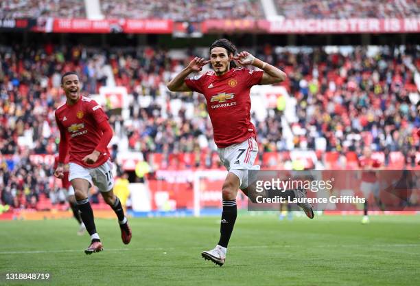 Edinson Cavani of Manchester United celebrates after scoring their side's first goal as Mason Greenwood looks on during the Premier League match...