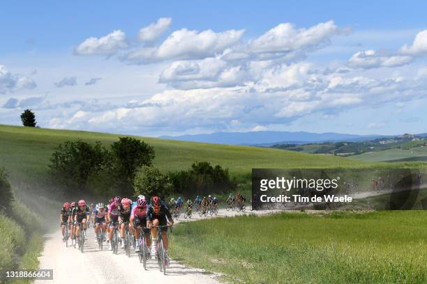 Egan Arley Bernal Gomez of Colombia Pink Leader Jersey & Filippo Ganna of Italy and Team INEOS Grenadiers lead The Peloton passing through a gravel...