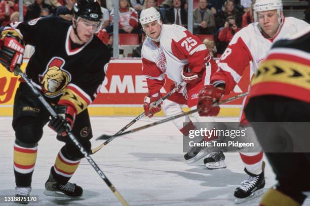 Darren McCarty, Right Wing for the Detroit Red Wings in motion on the ice during the NHL Eastern Conference Central Division game against the Ottawa...