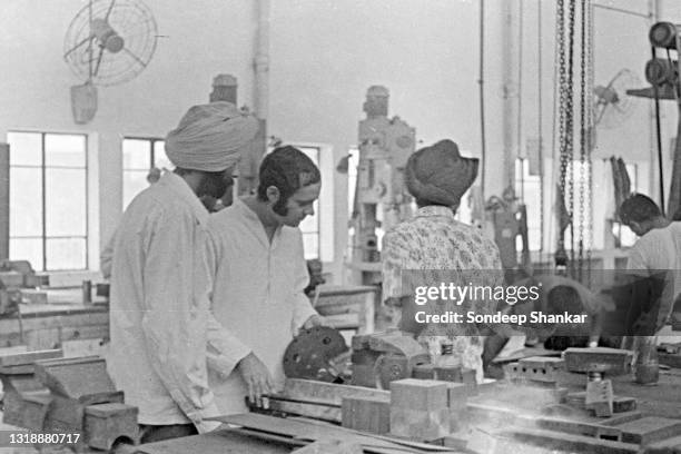 Prime Minister Indira Gandhi's son Sanjay Gandhi working in the Mariti Car manufacturing facility, his own enterprise, in Gurgram, Haryana June 1973.