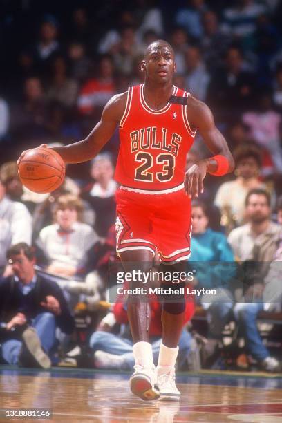 Michael Jordan of the Chicago Bulls dribbles up court during a NBA basketball game against the Washington Bullets at the Capital Centre on December...
