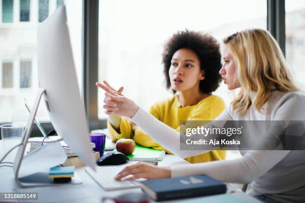 programmers working together on a computer code. - software as a service stock pictures, royalty-free photos & images