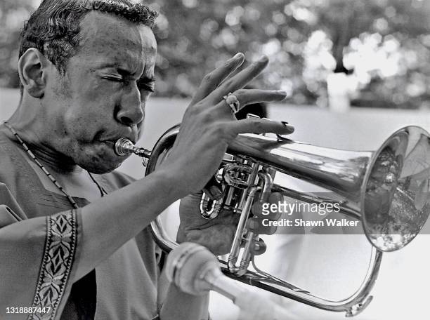 American Jazz musician Lee Morgan plays trumpet as he performs in Central Park, New York, New York, early 1970s.