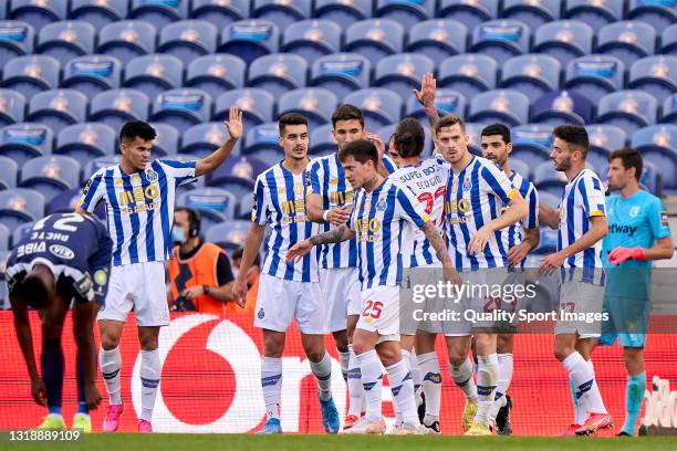 Mehdi Taremi of FC Porto with his team mates after scoring their side's first goal during the Liga NOS match between FC Porto and Belenenses SAD at...