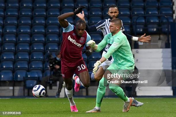 Michail Antonio of West Ham United is fouled by Sam Johnstone of West Bromwich Albion leading to a penalty during the Premier League match between...