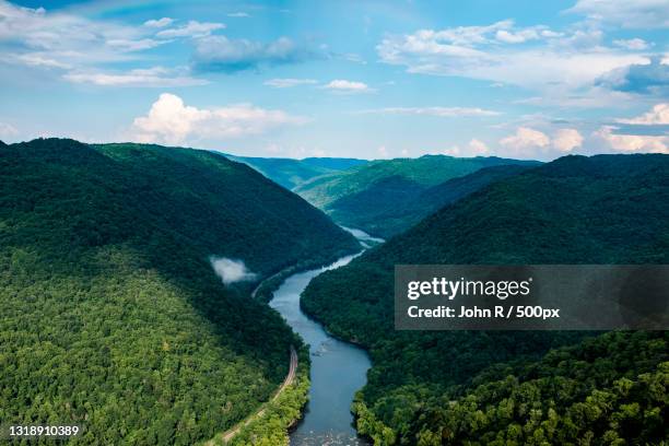 scenic view of river amidst mountains against sky,beaver,west virginia,united states,usa - appalachia stock-fotos und bilder