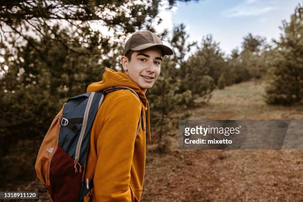 selfie mit geschwindigkeit - boy taking picture in forest stock-fotos und bilder
