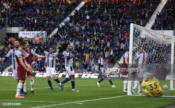 Hal Robson-Kanu and Kyle Bartley of West Bromwich Albion react as Matheus Pereira of West Bromwich Albion scores their first goal during the Premier...