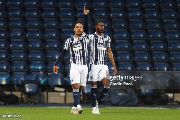 Matheus Pereira of West Bromwich Albion celebrates with team-mate Ainsley Maitland-Niles after scoring their first goal during the Premier League...