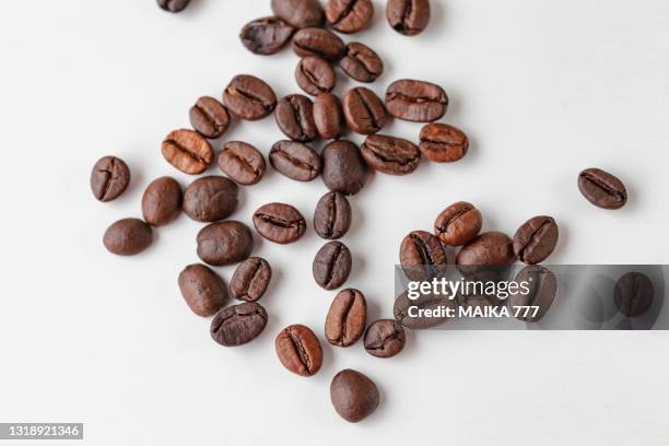 top view of coffee beans isolated on white background - coffee fotografías e imágenes de stock