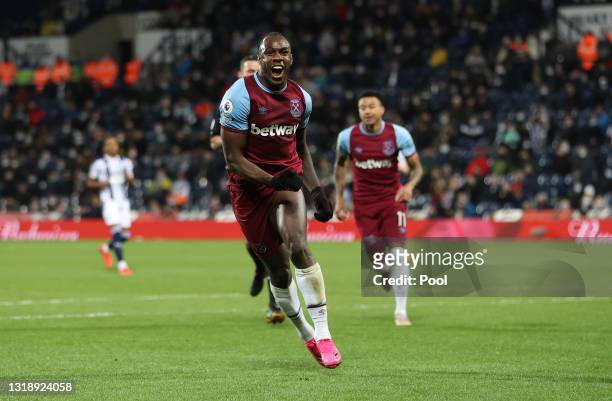 Michail Antonio of West Ham United celebrates after scoring his team's third goal during the Premier League match between West Bromwich Albion and...
