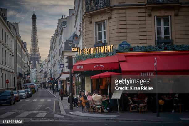 Parisians embrace the lifting of Covid-19 restrictions as cafes and restaurants across France re-open for the first time in over 6 months on May 19,...