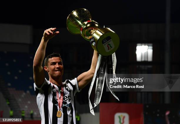 Cristiano Ronaldo of Juventus celebrates with the TIMVISION cup following the TIMVISION Cup Final between Atalanta BC and Juventus on May 19, 2021 in...