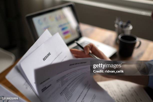 applying for a job, filing a resume experience, candidates stand the document with the company hr to get elected to work. - résumé stock pictures, royalty-free photos & images