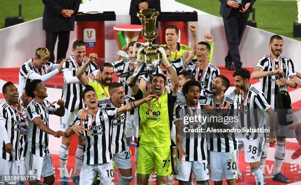 Gianluigi Buffon of Juventus lifts the trophy after the TIMVISION Cup Final between Atalanta BC and Juventus on May 19, 2021 in Reggio nell'Emilia,...