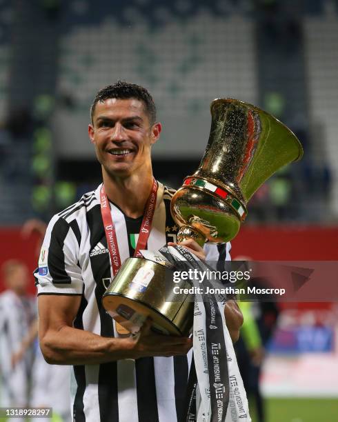 Cristiano Ronaldo of Juventus celebrates with the trophy following the 2-1 victory in the TIMVISION Cup Final between Atalanta BC and Juventus at...