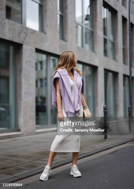Michi Brandl wearing beige LeGer knit dress, beige Bottega Veneta leather bag, lilac Zara hoodie and sneakers by Copenhagen Studios on May 11, 2021...