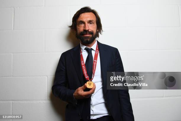 Andrea Pirlo, Head coach of Juventus poses for a photo with his winners medal after the TIMVISION Cup Final between Atalanta BC and Juventus on May...
