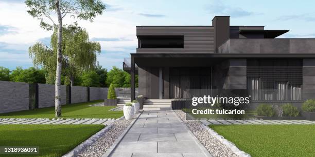 fully black stone modern luxurious villa with garden. - stone house garden stock pictures, royalty-free photos & images