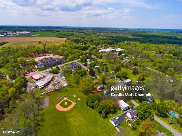 aerial of small town and baseball diamond - localidad pequeña fotografías e imágenes de stock
